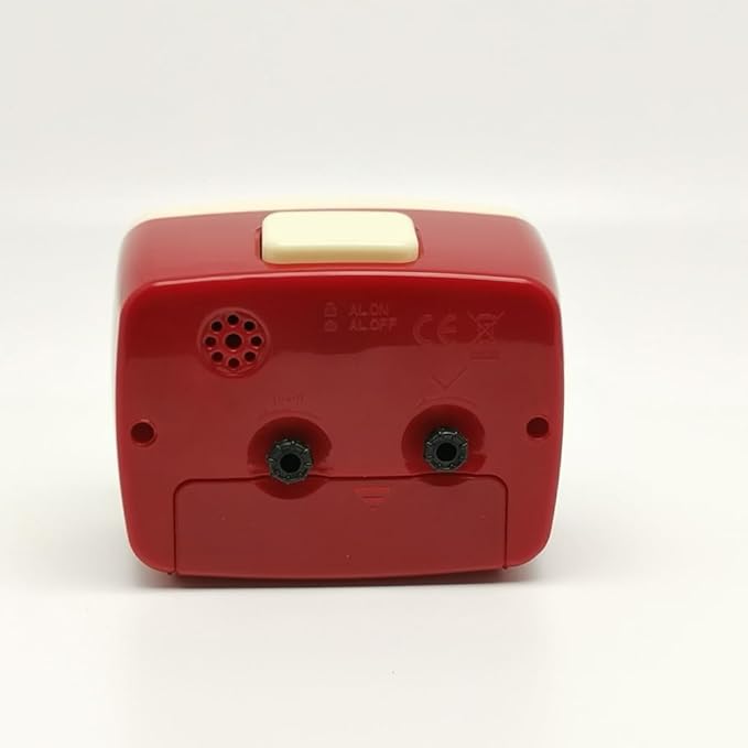Red electronic device with a white button on a white background