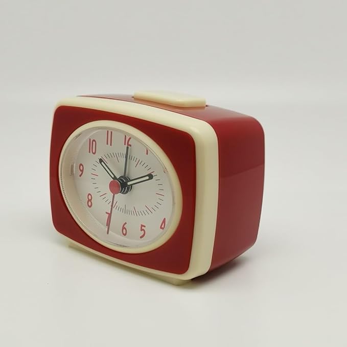 Red and beige vintage-style alarm clock on a white background