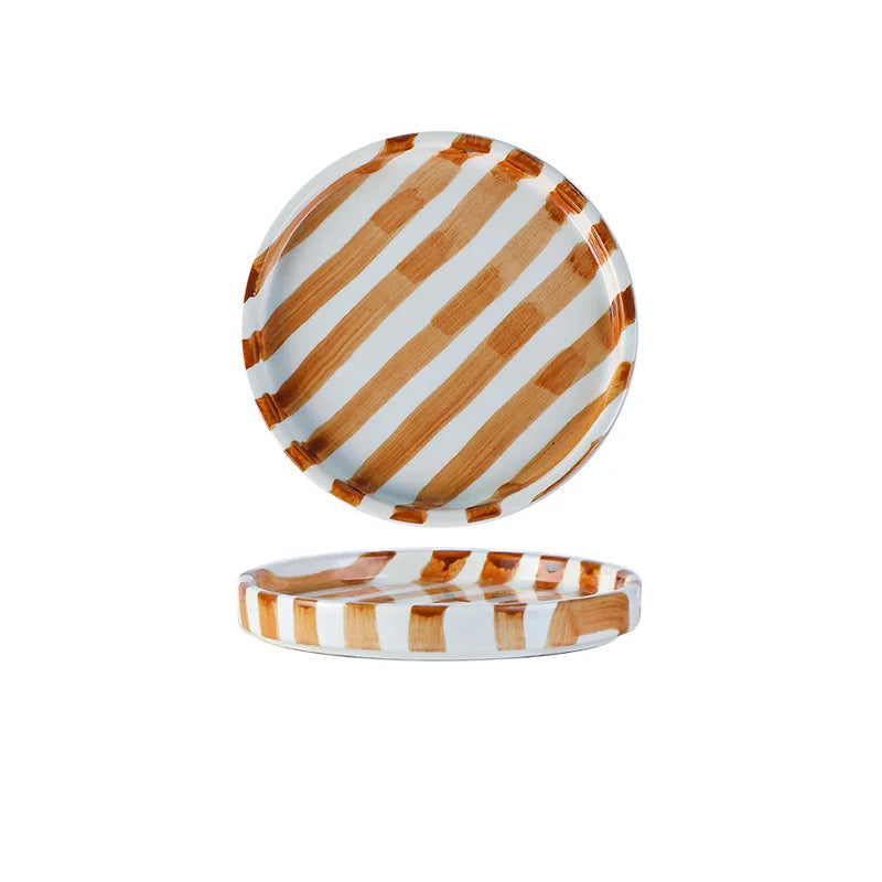 Round plate with brown and white striped pattern on a white background
