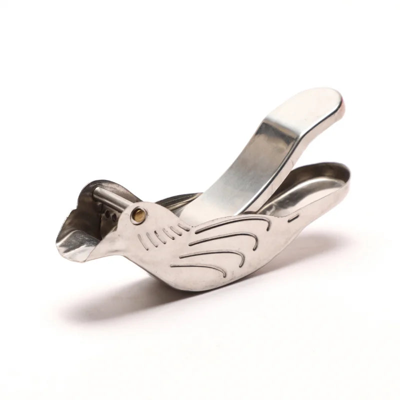 Metallic guitar capo on a white background