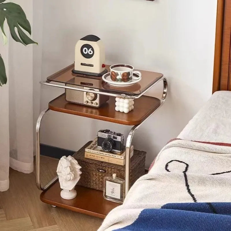 Small wooden side table with decorative items in a room setting