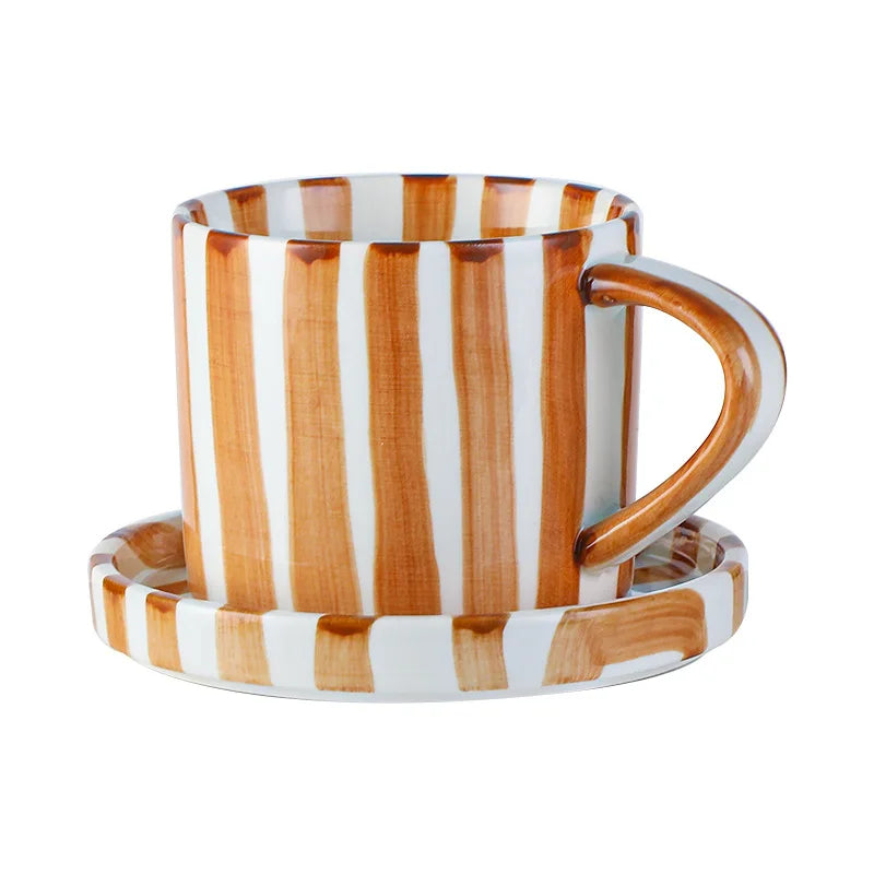 Striped mug with wooden handle on a white background