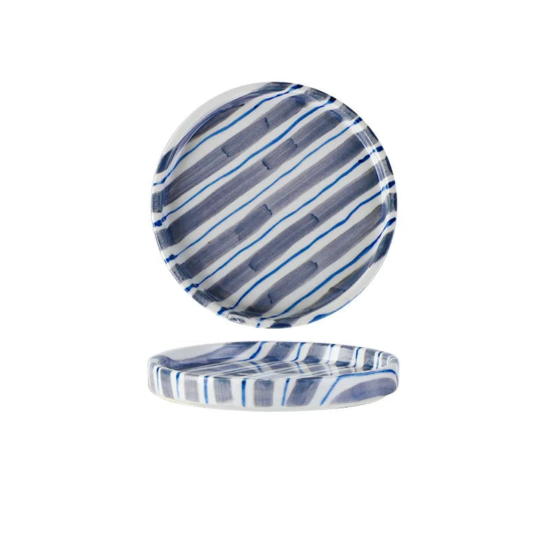 Blue and white striped ceramic plate with measurements on a white background