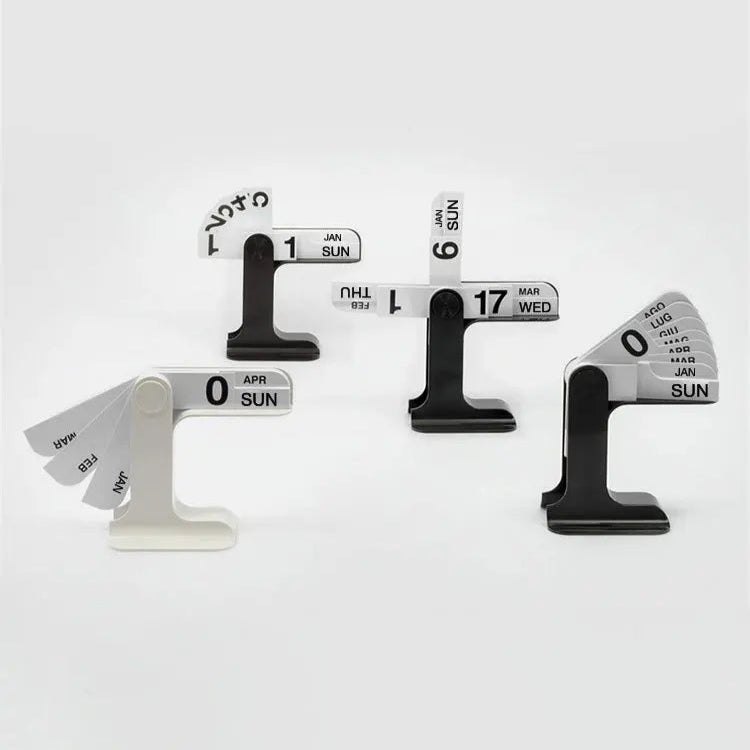 Set of four black and white calendar clips on a white background