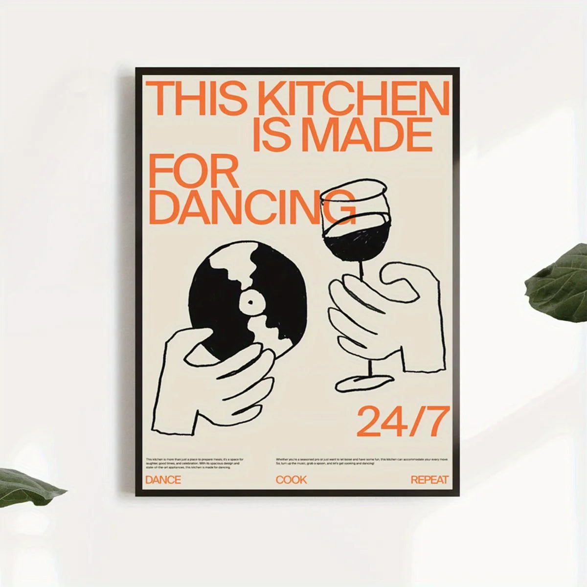 Poster with text 'This kitchen is made for dancing 24/7' on a white wall.