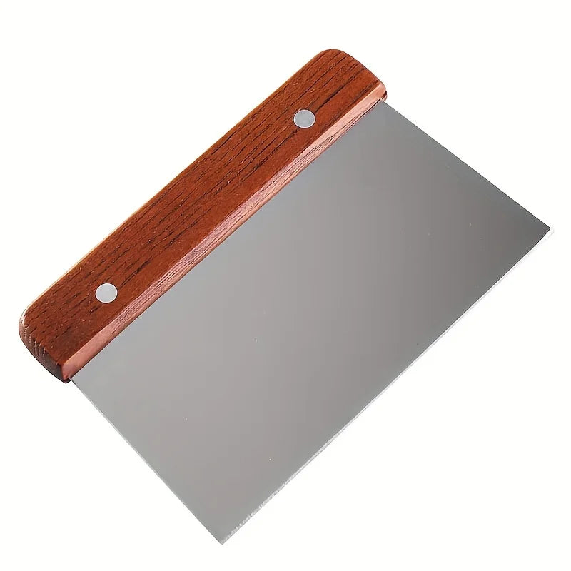 Metal spatula with wooden handle on a white background