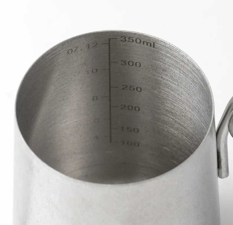 Metal measuring cup with volume markings on a white background
