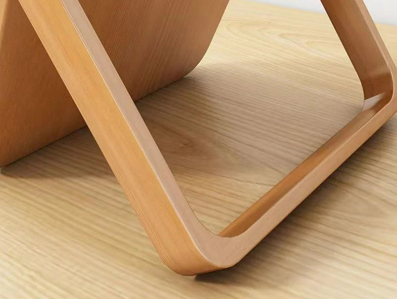 Wooden mirror stand on a wooden surface