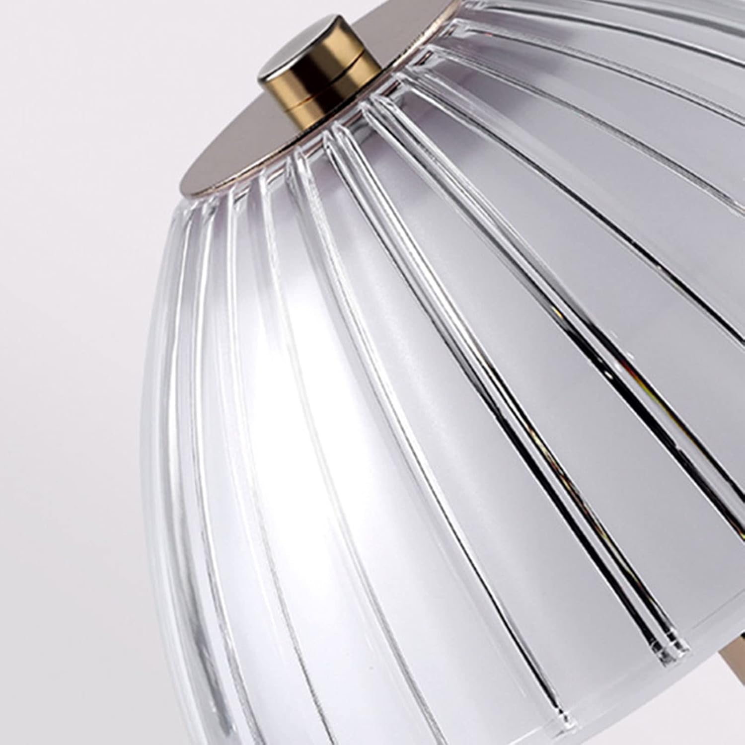 A close up of a fluted glass lamp
