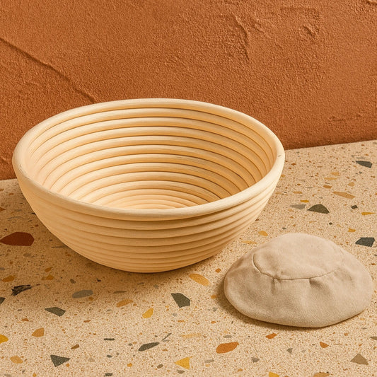 Bread proofing basket on a terrazzo countertop with a brown wall background