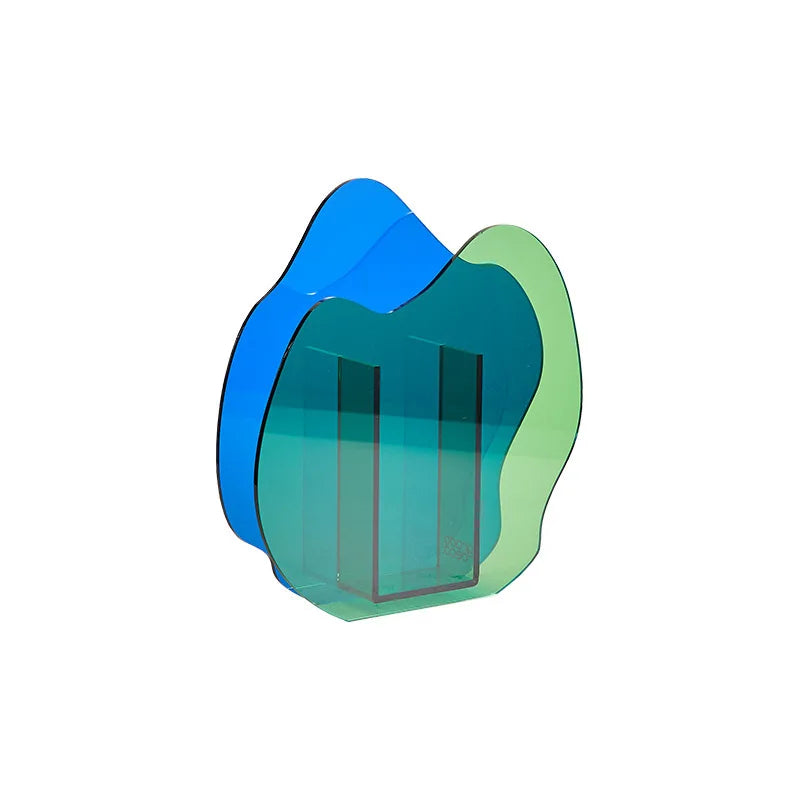 A blue asymmetric vase on a white background