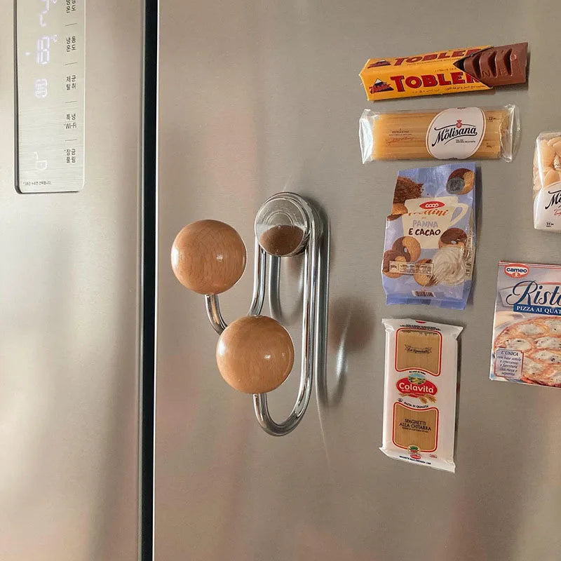 Fridge with various packages attached, including Toblerone and Milka chocolate bars.