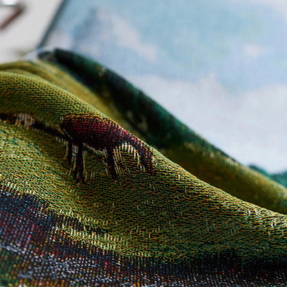 Close-up of a textured fabric with embroidered design on a garment.