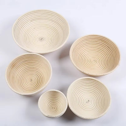 Set of five woven baskets of different sizes on a white background