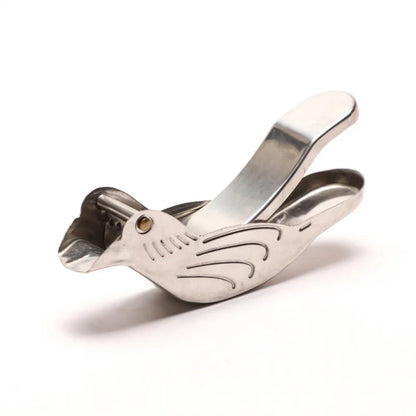 Metallic guitar capo on a white background