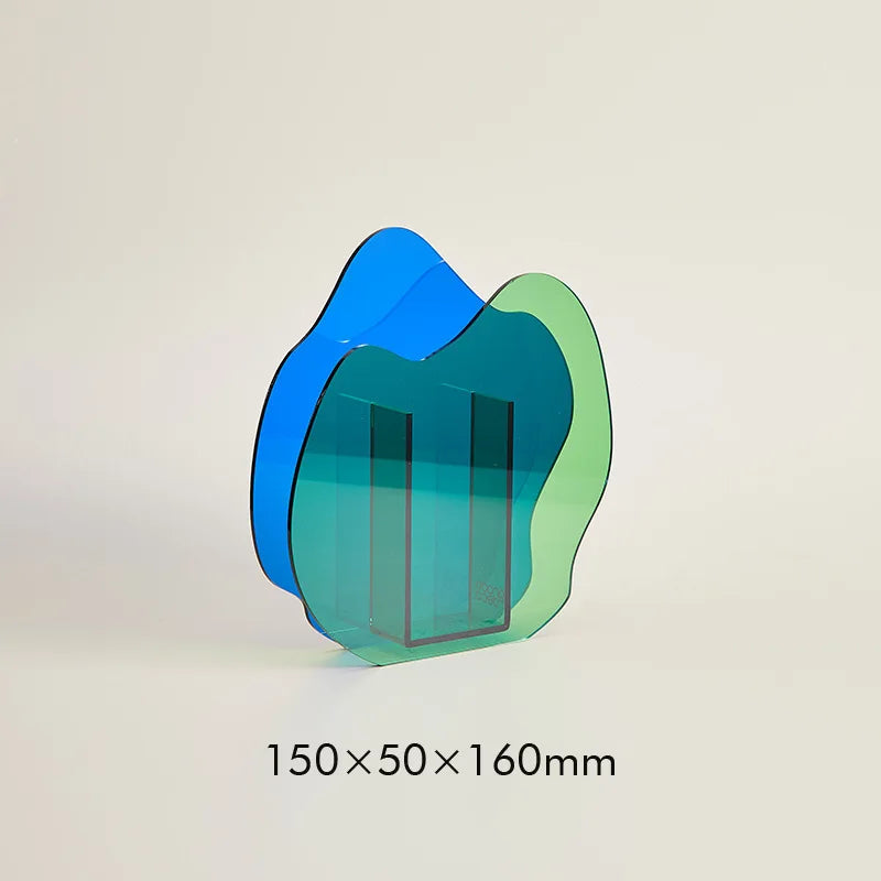 A blue asymmetric vase on a white background