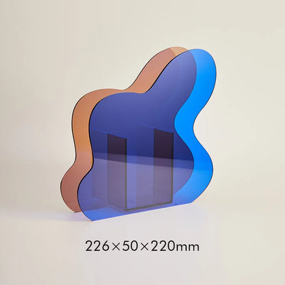 Wavy glass vase with blue and brown colors on a beige background
