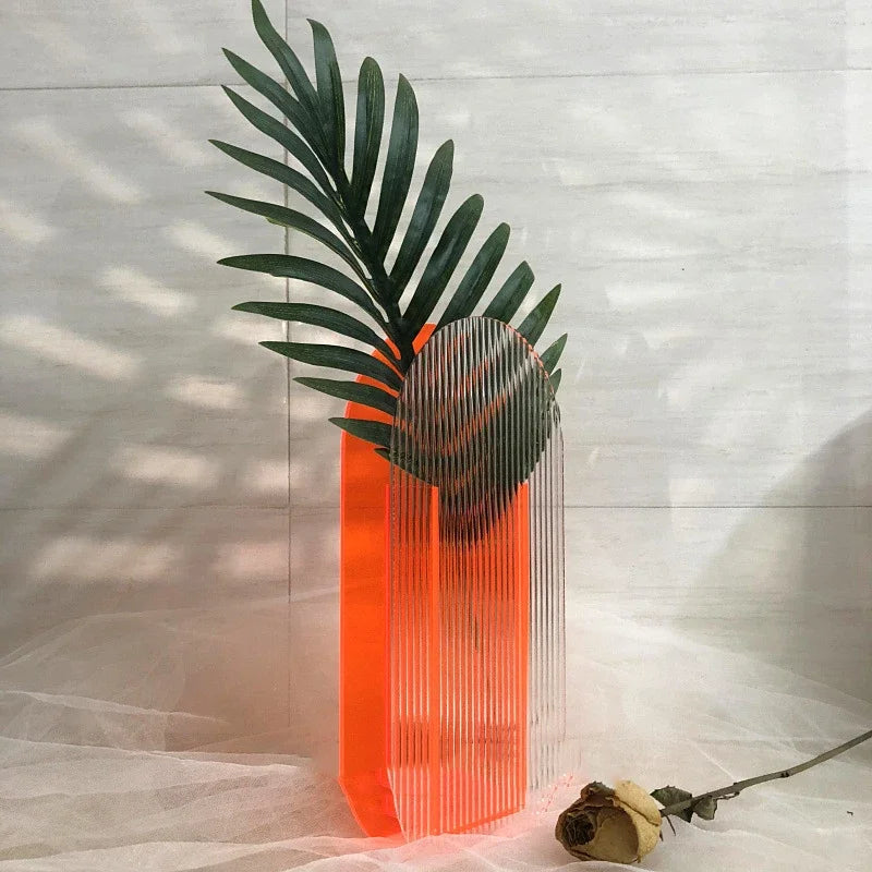 Bright orange vase on white backdrop 