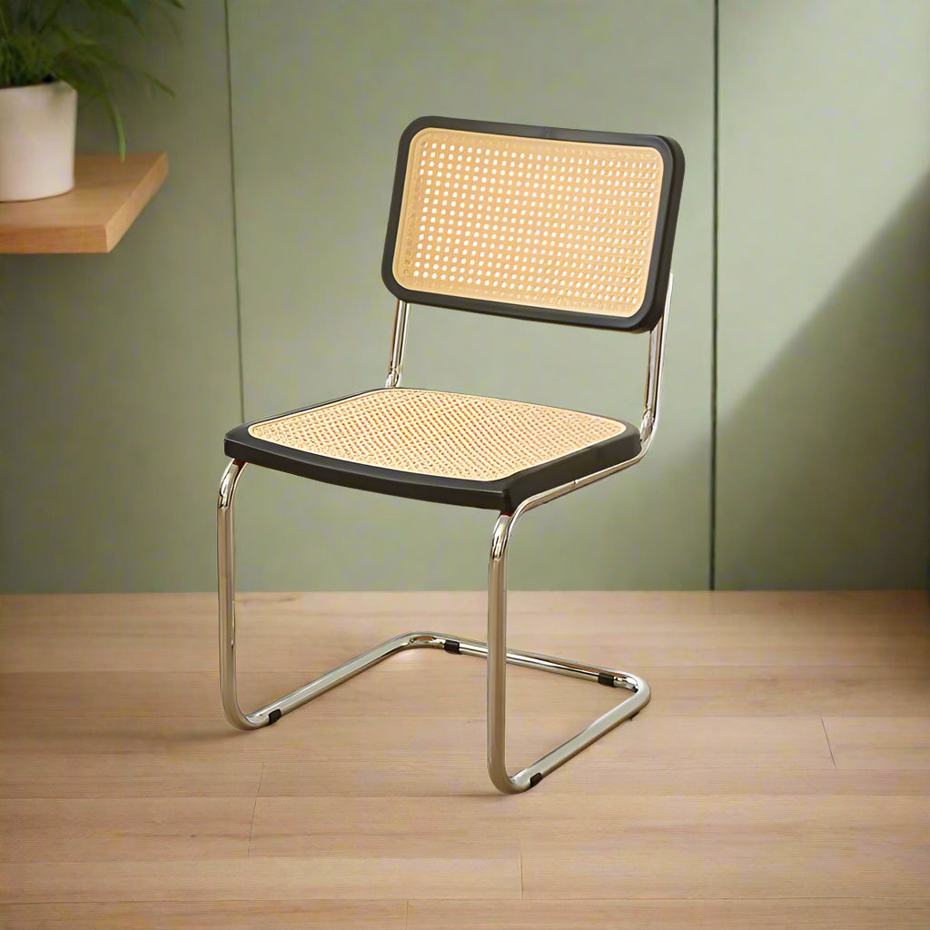 Chair with wicker backrest and seat on a light gray background