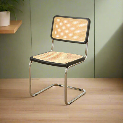 Chair with wicker backrest and seat on a light gray background