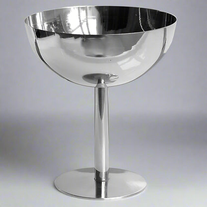 Silver bowl on a stand against a white background