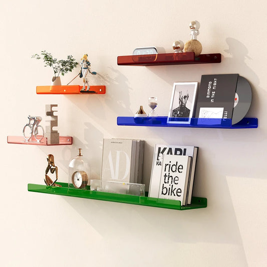 Various coloured shelves displaying items on a white wall