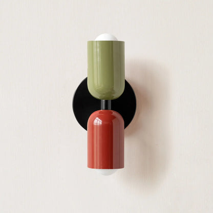 Modern wall sconce with green and red design on a white background
