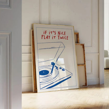 Framed artwork with a record player illustration and text on a wall.