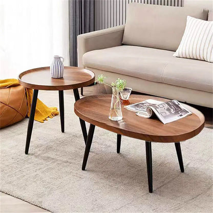 Wooden coffee table with a vase and newspaper in a living room setting