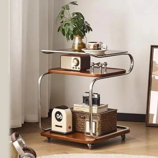 Wooden side table with metal legs in a room setting