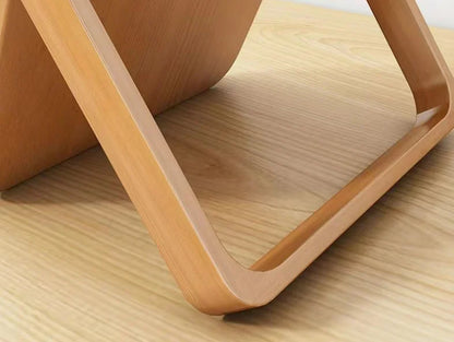 Wooden mirror stand on a wooden surface