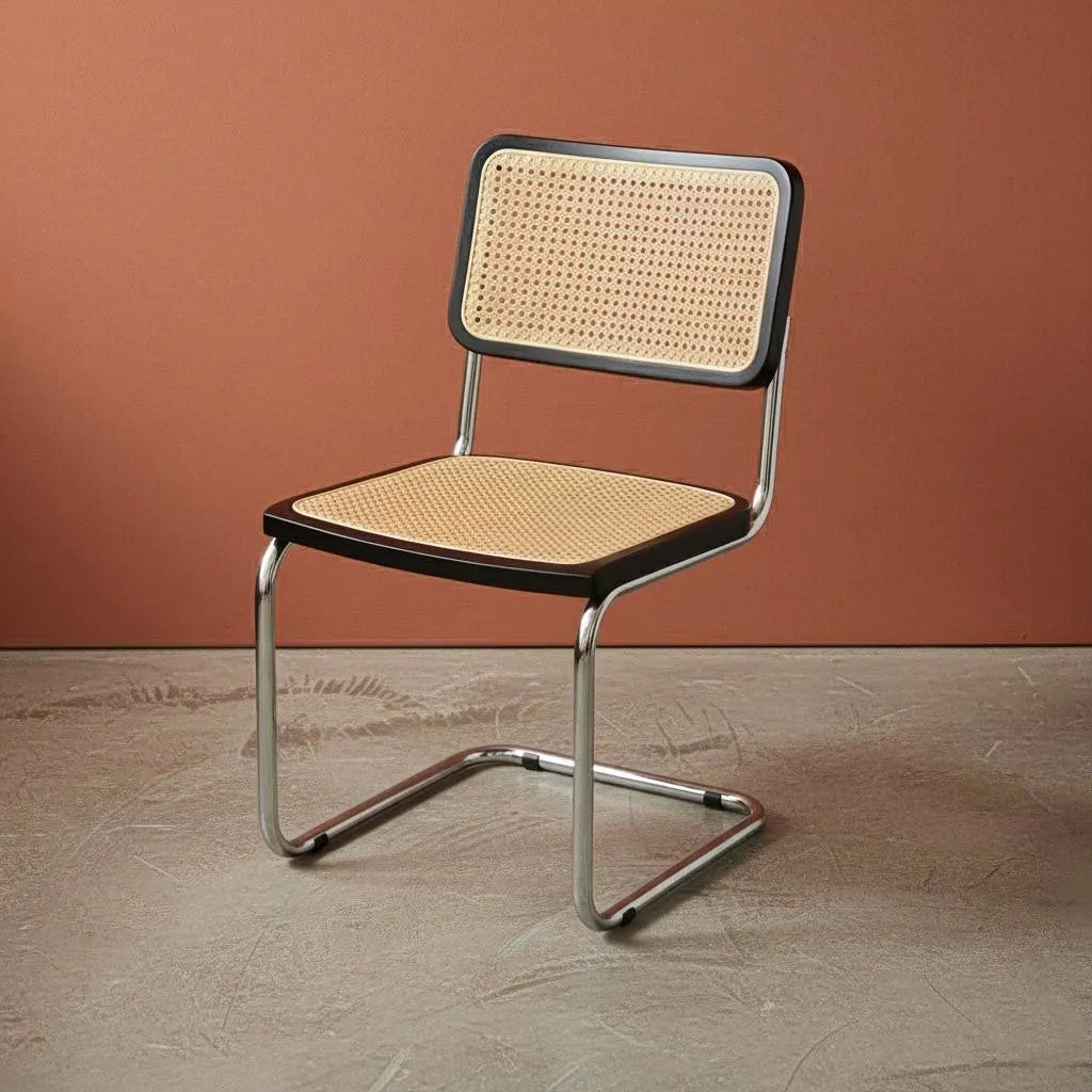 Chair with wicker seat and backrest against a brown wall